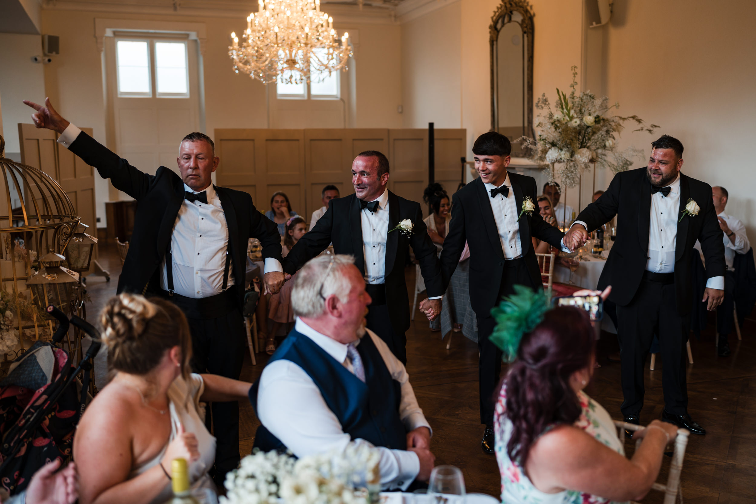 Groomsmen dancing in together