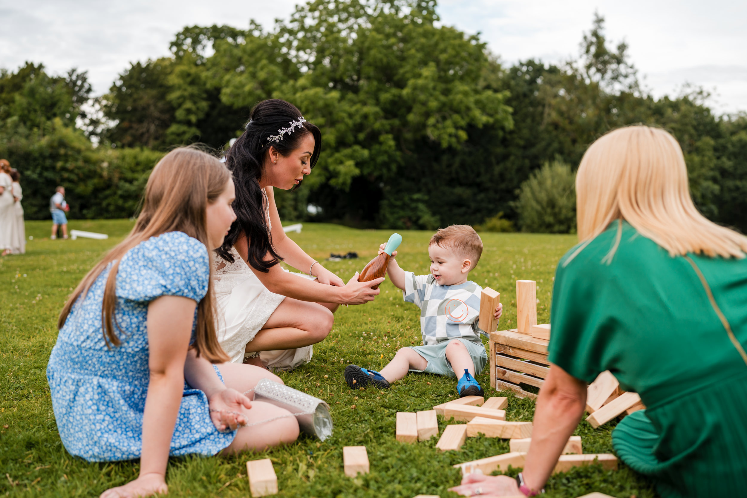 Bride with her son playing outside