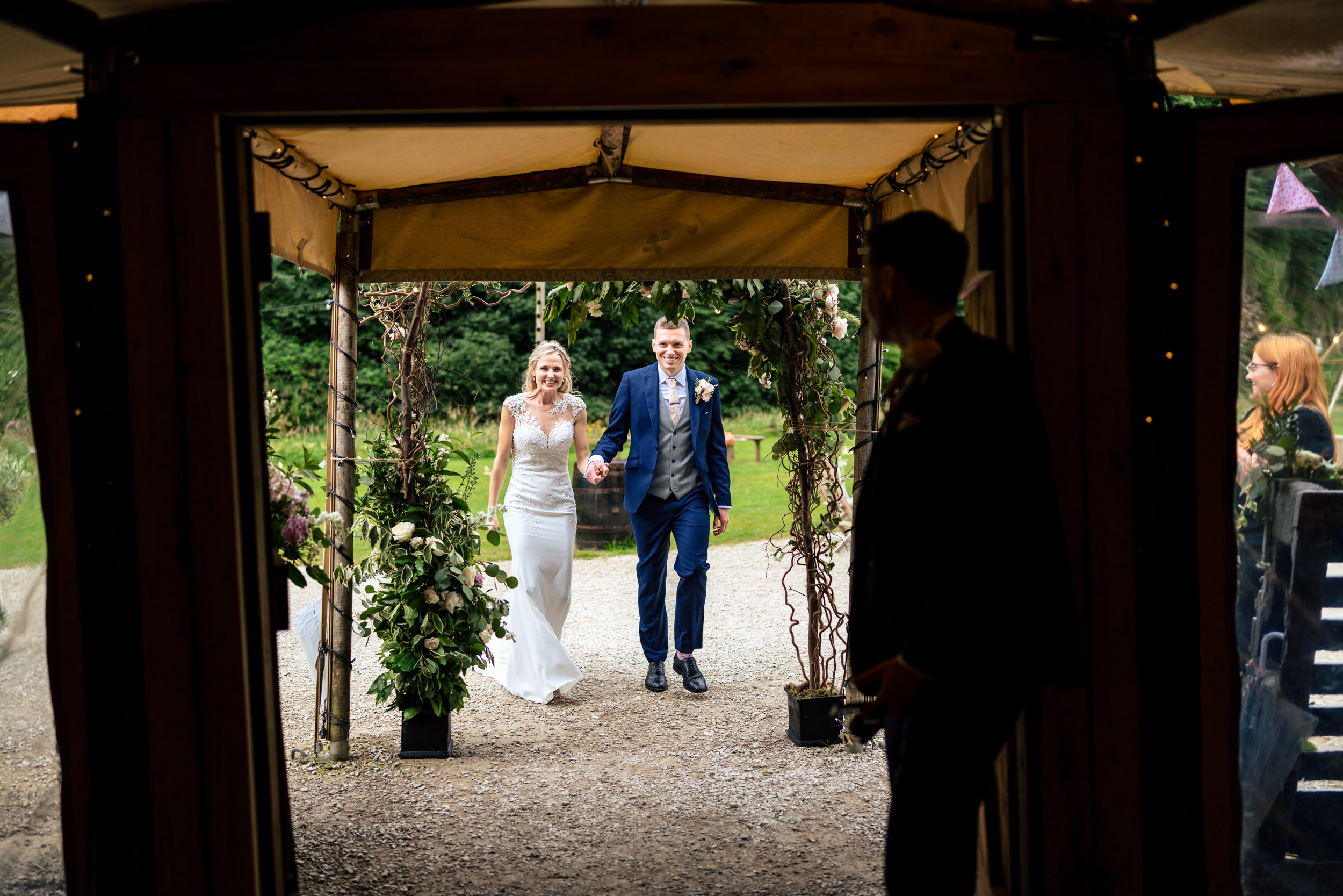 Bride and groom entering for their wedding breakfast