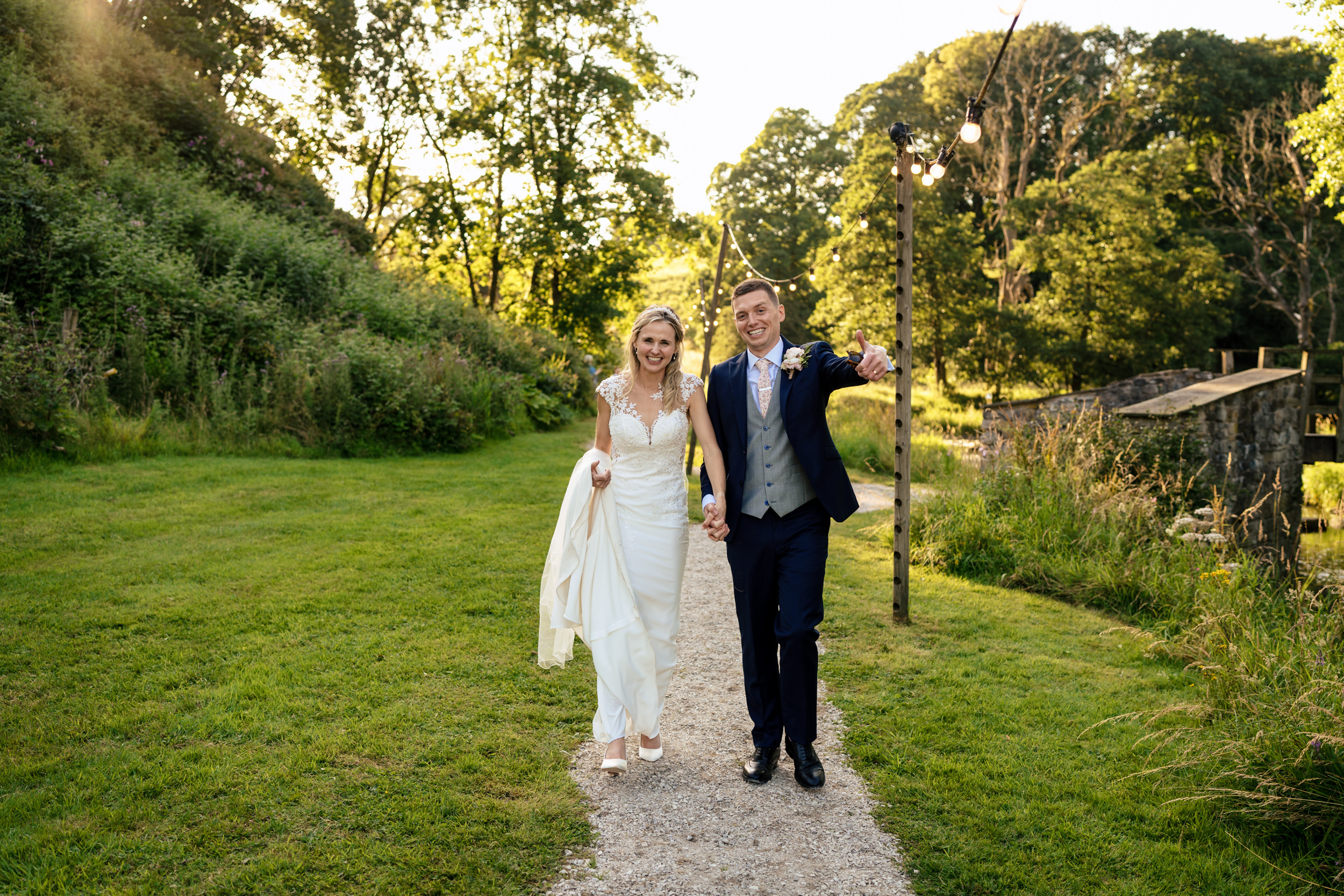 Bride and groom after Duck race in the river at Gisburn Park