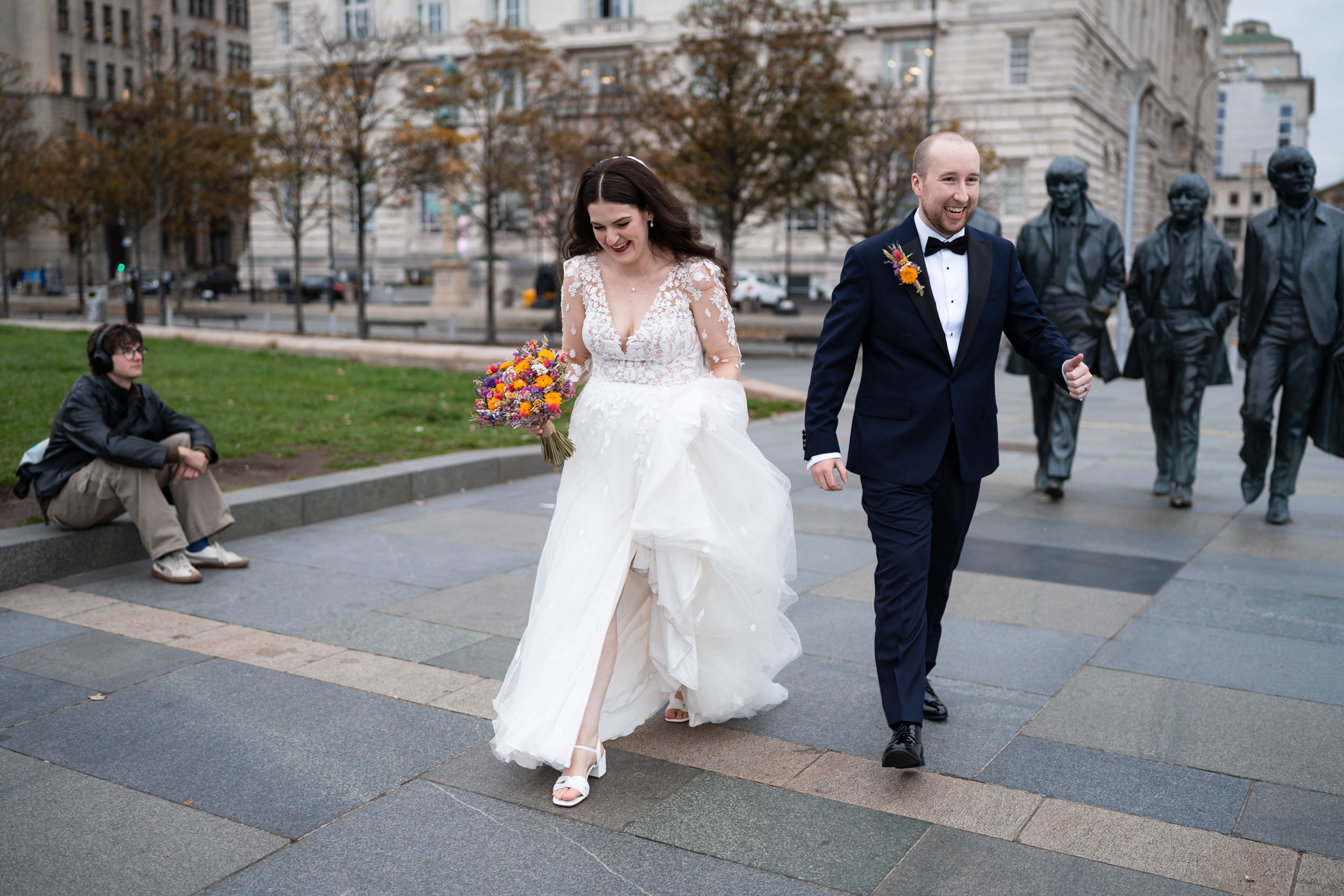 Couple walking together through the Albert Docks, Liverpool
