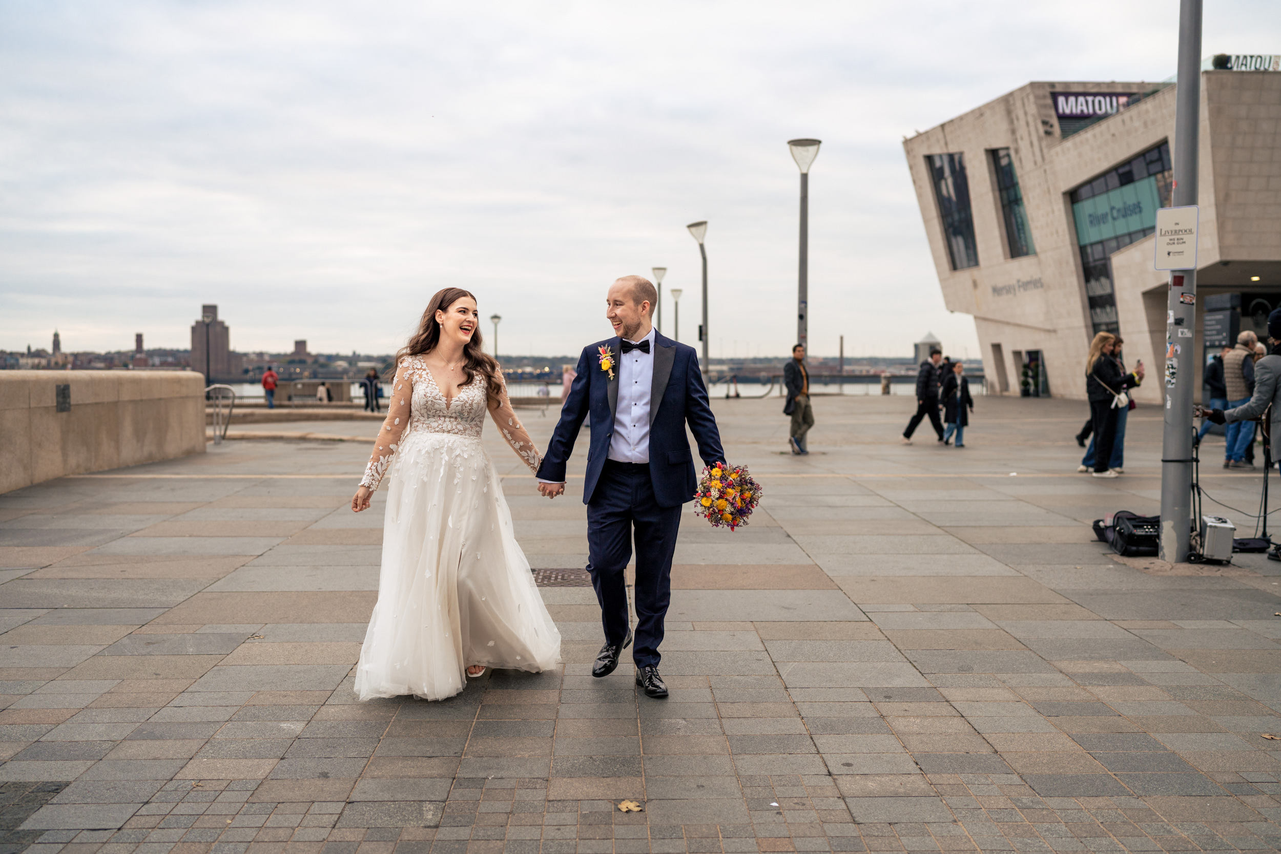 Couple walking together through the Albert Docks, Liverpool
